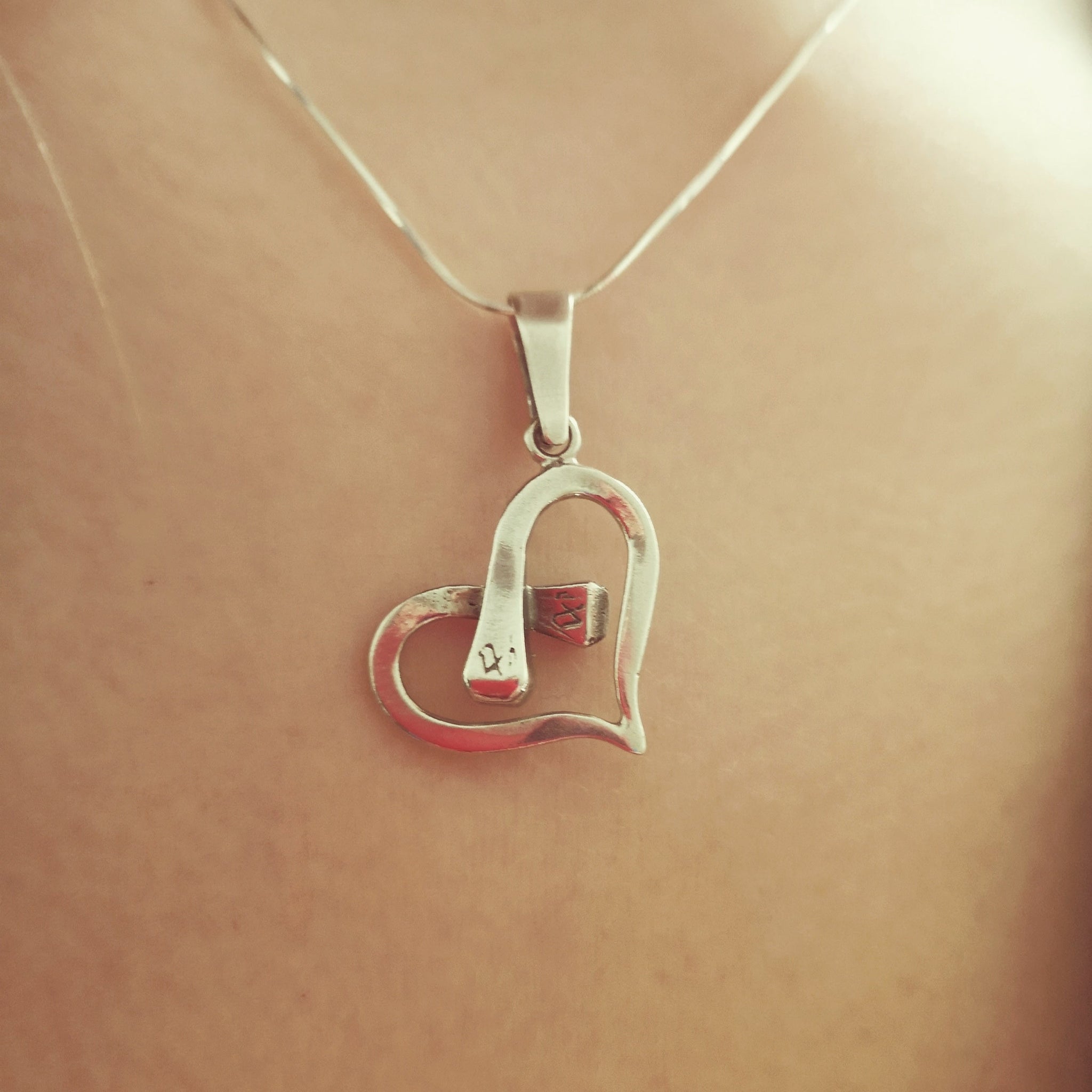 Horseshoe nail heart hot sale necklace