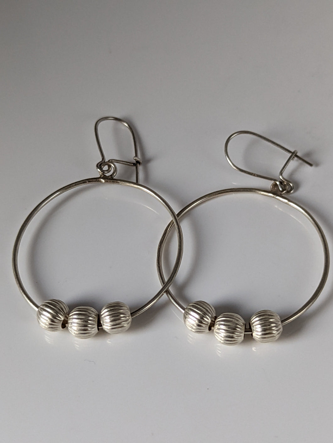 Silver Steed Loop with Buds Dangling Earrings